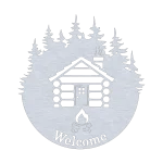 A circular metal wall sign with a laser-cut log cabin featuring a smoking chimney surrounded by pine trees. Below the cabin, the word 'Welcome' is cut out with a campfire symbol. The metallic finish adds a rustic charm, perfect for cabins or lodges.